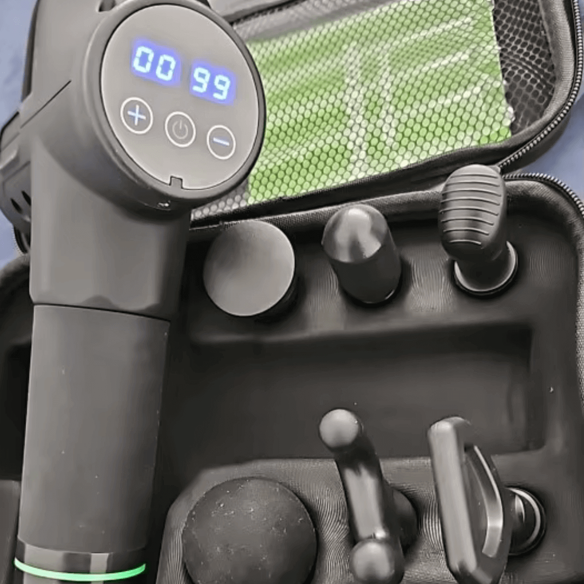 Black massage gun with attachments