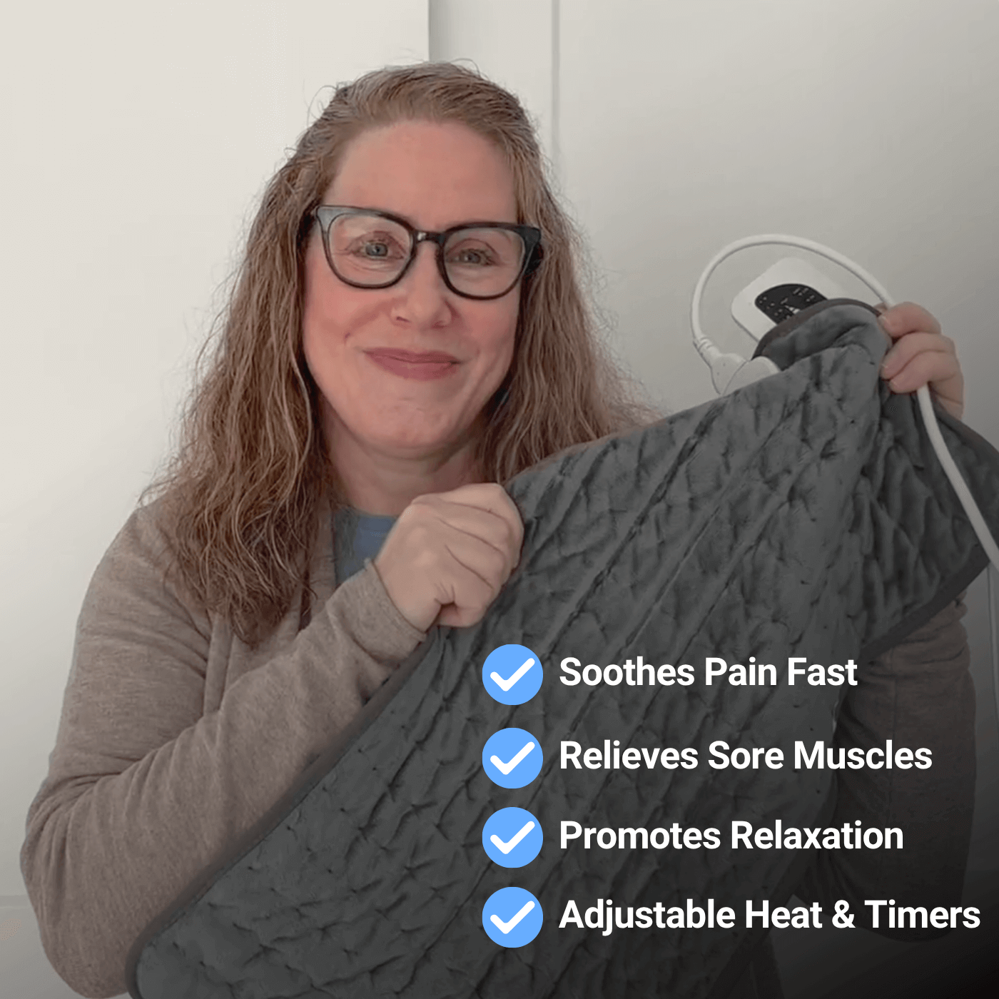 Woman with heating pad, soothes pain, relieves muscles.