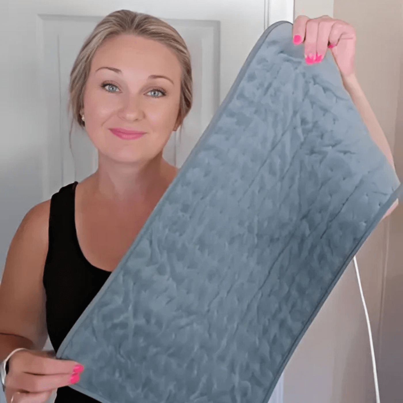 Woman holding Product 1 heating pad